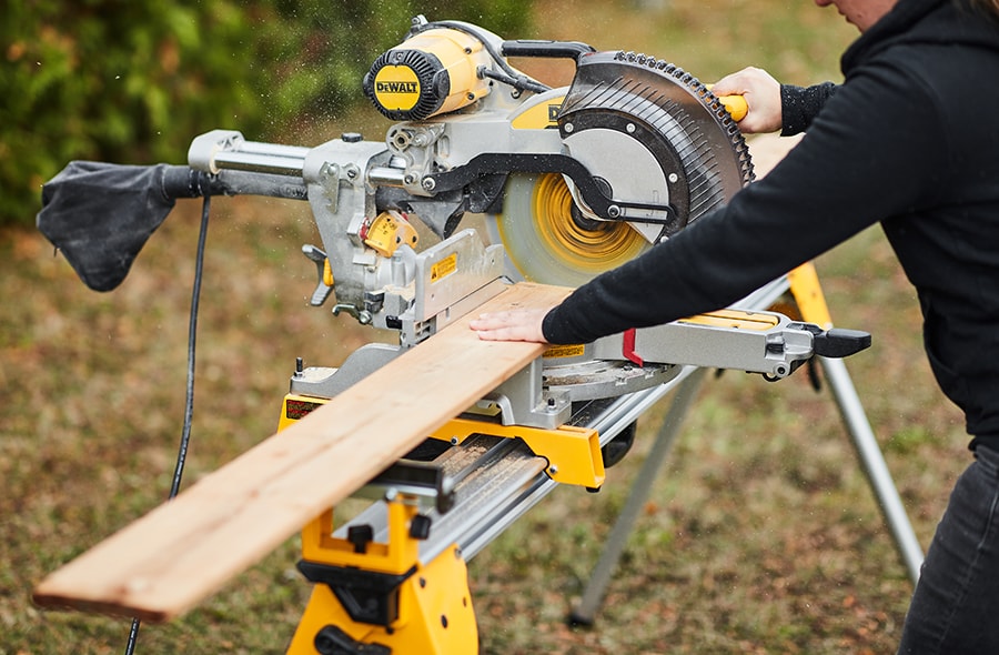Person using a mitre saw