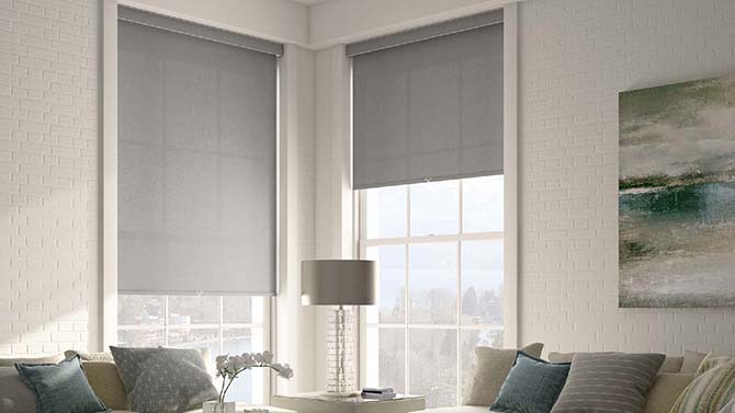 living room with grey shades covering windows